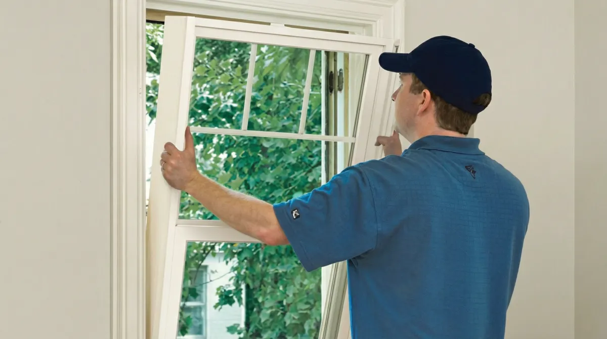 Professional contractors performing a residential window insulation and replacement service in Marietta, GA